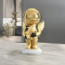 The Seraph gold winged astronaut sculpture